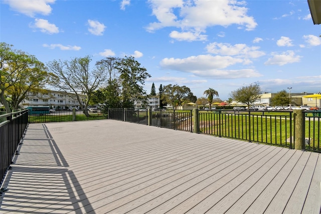 wooden terrace with a lawn