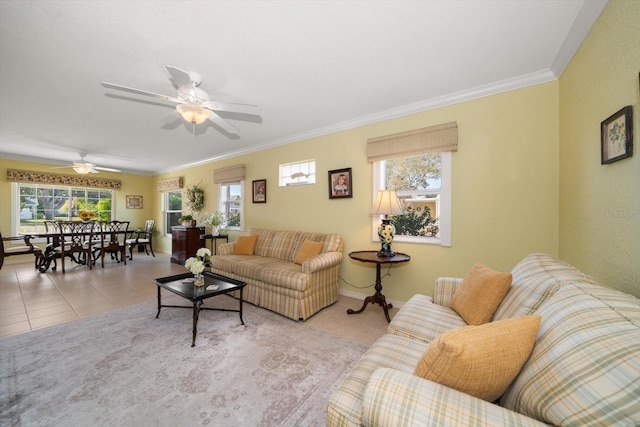 living room featuring light tile patterned floors, crown molding, and ceiling fan