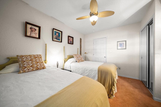 carpeted bedroom with a closet and ceiling fan