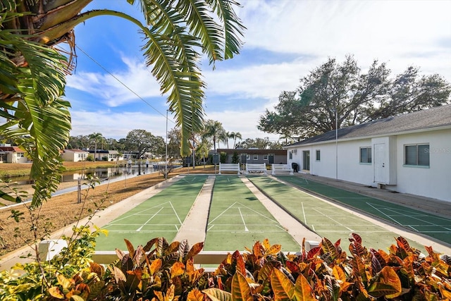 surrounding community featuring a water view