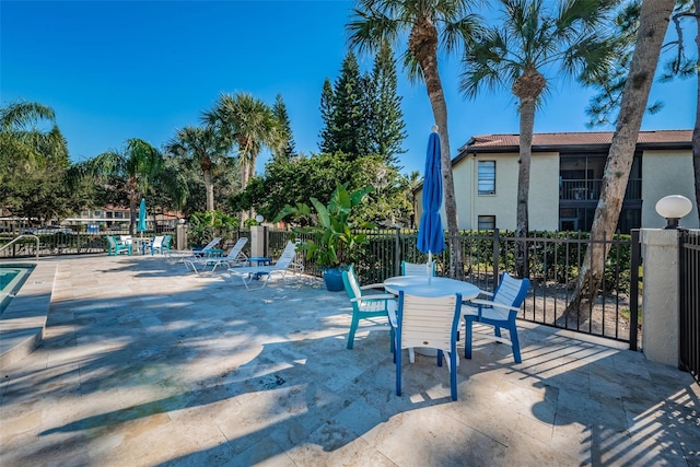 view of patio / terrace featuring fence