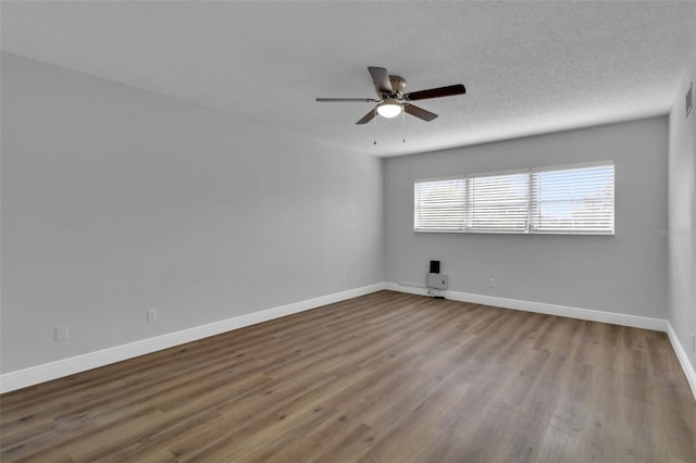 unfurnished room with hardwood / wood-style floors, a textured ceiling, and ceiling fan