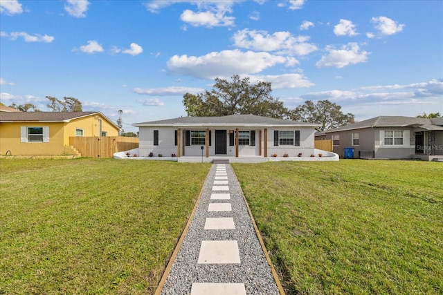 view of front of property with a front yard and covered porch