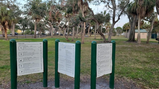 view of property's community with a lawn