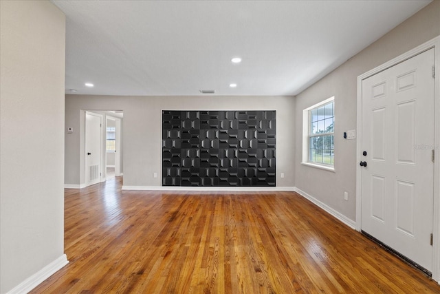 entryway with wood-type flooring