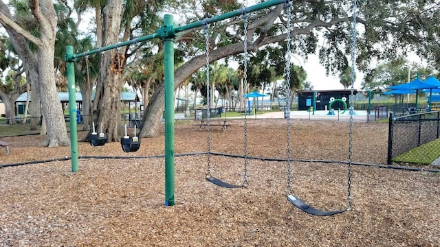 view of property's community featuring a playground