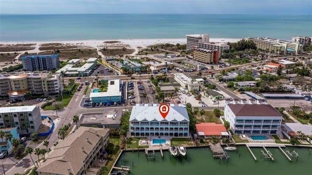 bird's eye view featuring a water view and a view of the beach