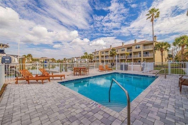 view of swimming pool with a patio area