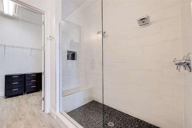 bathroom with a tile shower