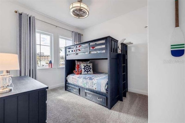 bedroom featuring light colored carpet