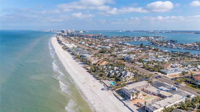 birds eye view of property with a water view and a view of the beach