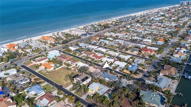 bird's eye view featuring a beach view and a water view