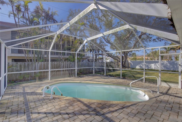 view of pool featuring a lanai and a patio