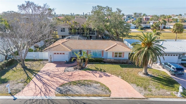 view of front facade with a garage and a front yard