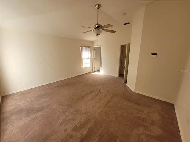 spare room with high vaulted ceiling, ceiling fan, and dark colored carpet