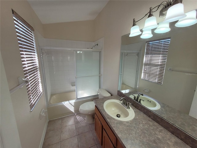 full bathroom with tile patterned floors, toilet, lofted ceiling, vanity, and enclosed tub / shower combo