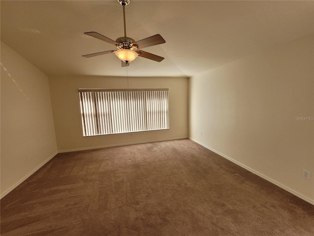 spare room with carpet flooring and ceiling fan