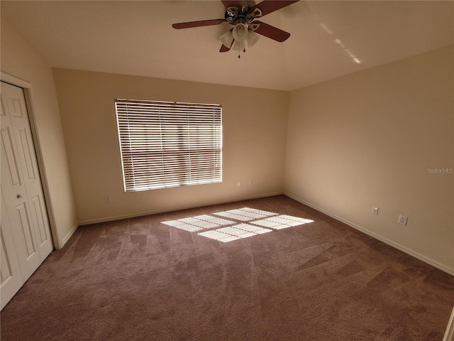 interior space with carpet and ceiling fan