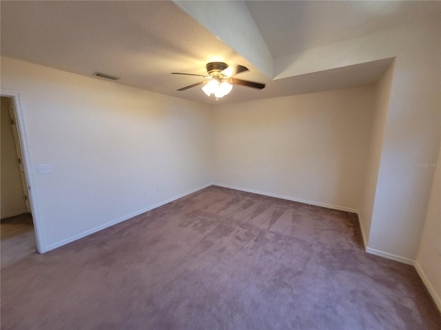 spare room featuring ceiling fan and carpet