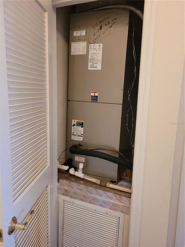 utility room with heating unit