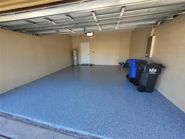 garage featuring a garage door opener, electric panel, and electric water heater