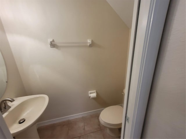 bathroom with tile patterned floors, toilet, and sink