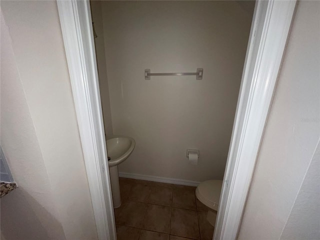 bathroom featuring tile patterned floors and toilet