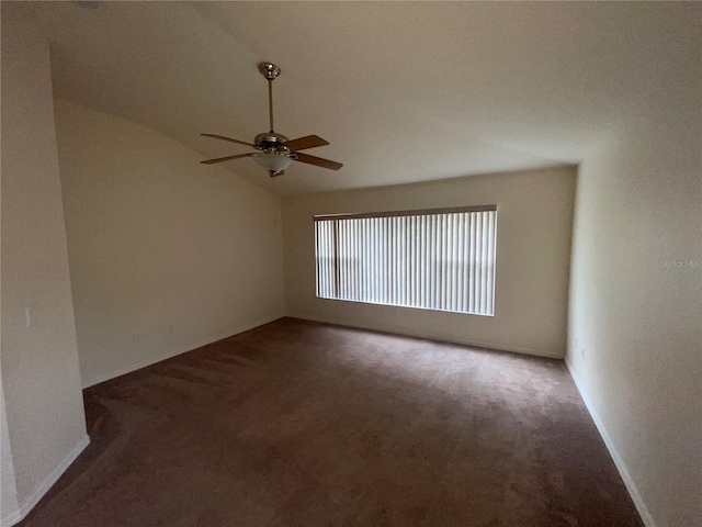 carpeted empty room featuring lofted ceiling and ceiling fan