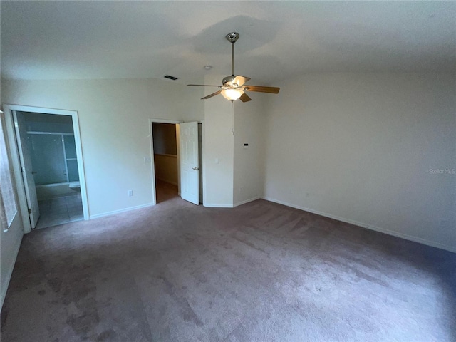 unfurnished bedroom featuring vaulted ceiling, carpet, and ceiling fan