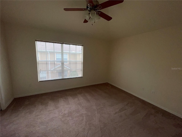 carpeted empty room with ceiling fan