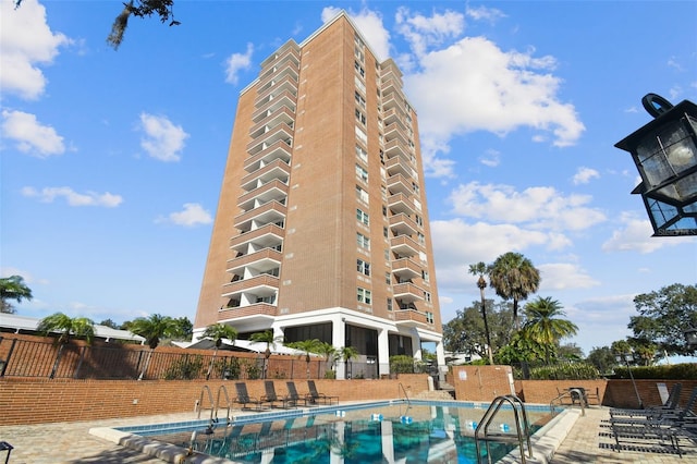 view of swimming pool featuring a patio area