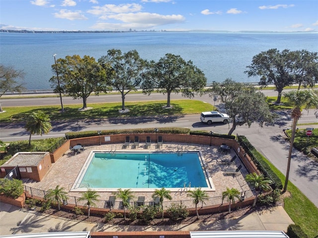 view of pool with a water view