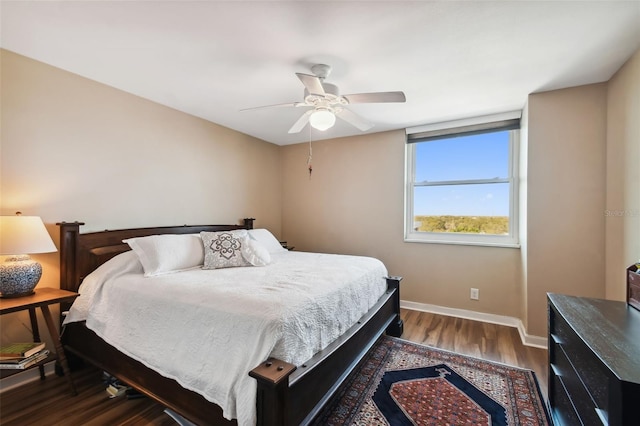 bedroom featuring dark wood-type flooring and ceiling fan