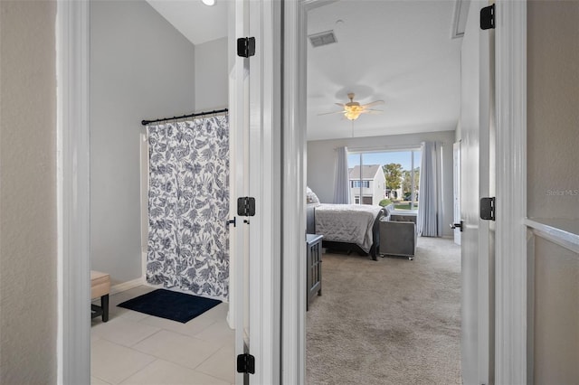 bathroom with ceiling fan and walk in shower