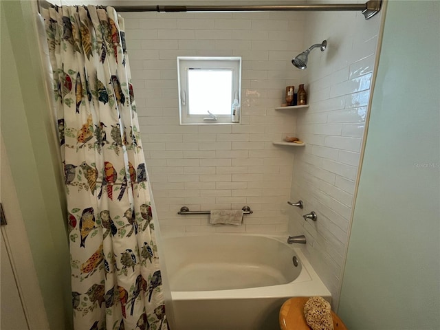 bathroom featuring shower / bath combo with shower curtain