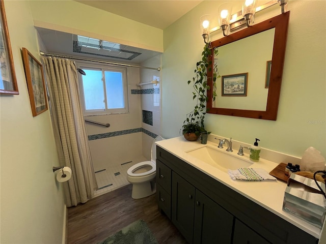 bathroom featuring a shower with curtain, vanity, toilet, and wood-type flooring