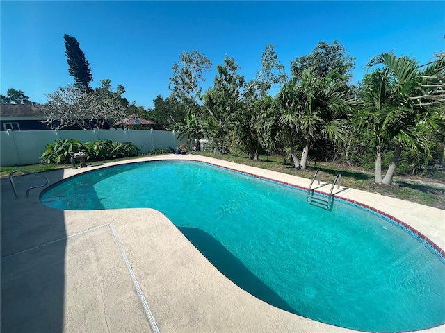 5730 16th Ln NE, Saint Petersburg, FL 33703 - view of pool featuring a fenced in pool, a fenced backyard, and a patio area
