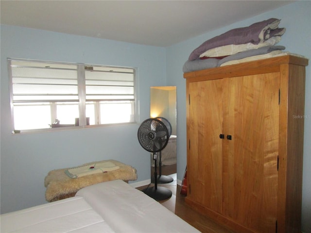 bedroom featuring dark hardwood / wood-style flooring