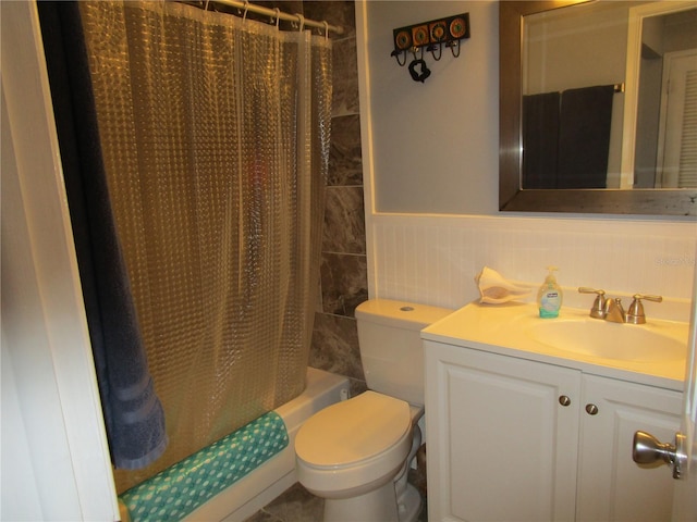 full bathroom featuring shower / bathtub combination with curtain, vanity, and toilet