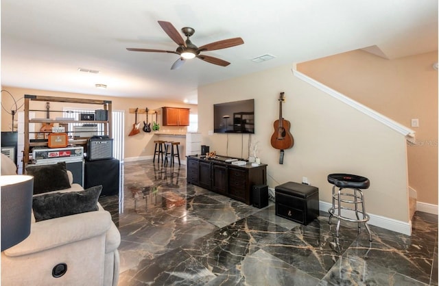 living room featuring ceiling fan