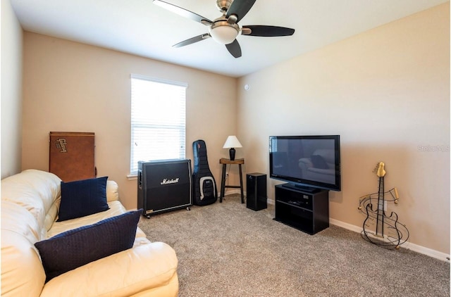 carpeted living room with ceiling fan