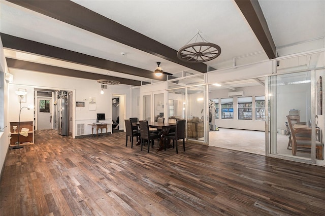 dining area featuring beamed ceiling, an AC wall unit, and dark wood-type flooring