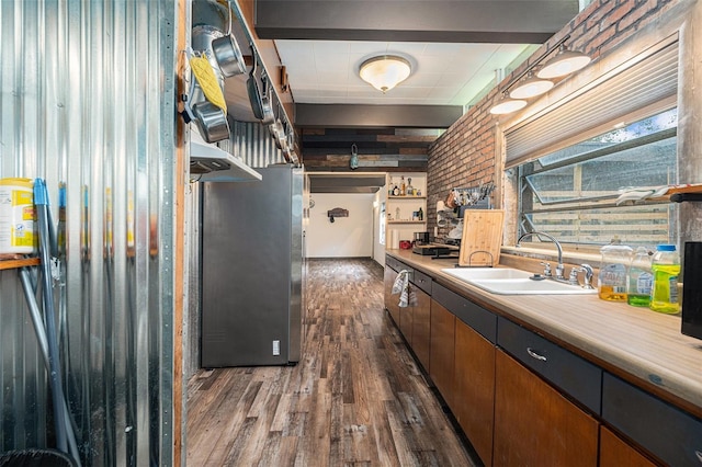 kitchen with sink, dark wood-type flooring, and stainless steel refrigerator