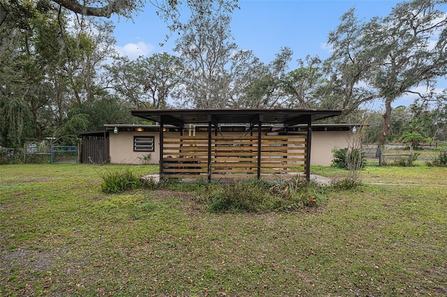 view of outbuilding with a yard