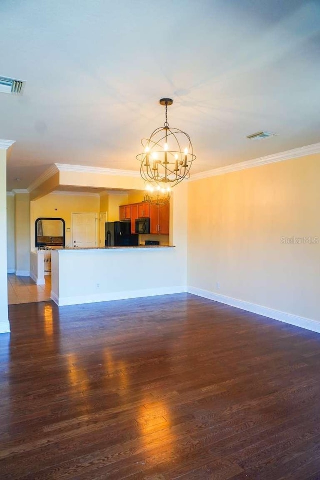 unfurnished living room with crown molding and dark hardwood / wood-style floors