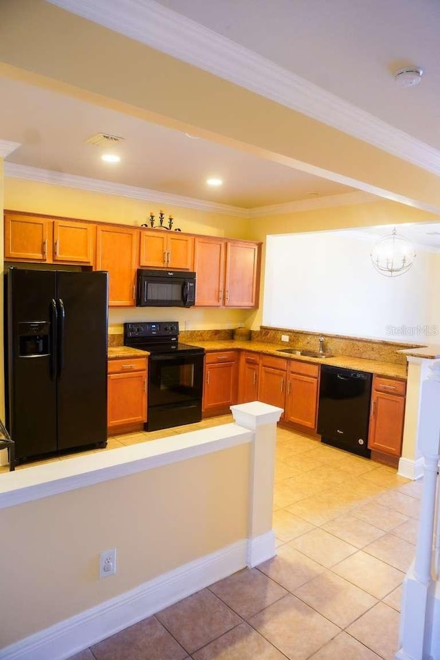 kitchen with black appliances, ornamental molding, light tile patterned floors, and a sink