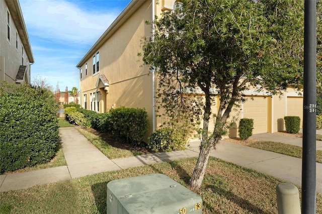 view of home's exterior featuring a garage and stucco siding