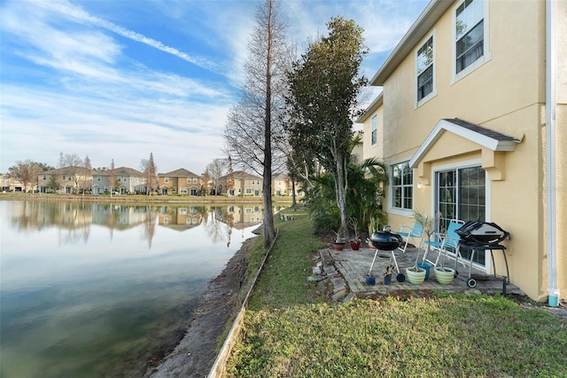 view of yard with a water view and a residential view