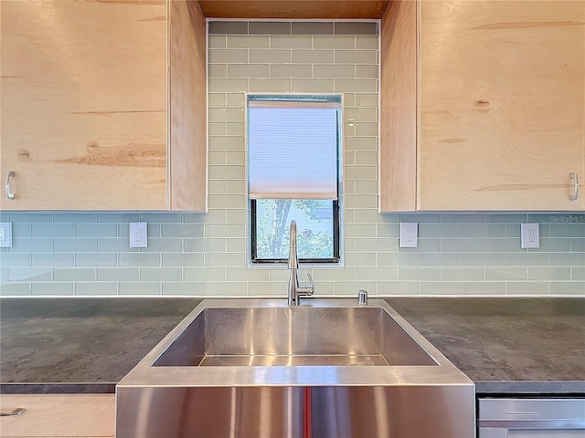 interior details featuring tasteful backsplash and sink