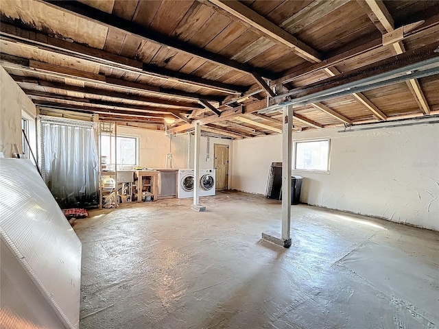 basement featuring wood ceiling and washing machine and dryer